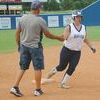 HOME RUN: Marlow’s Mia Meshell is congratulated by coach Brian Miller as she rounds third base following her home run against Elgin in the final night of the Marlow Summer League play Monday. The Lady Outlaws open the season Monday against Plainview.
