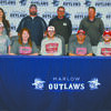 SNU BOUND: Marlow senior baseball player Tanner Ladon signed with Southern Nazarene University in Bethany last Wednesday. Pictured: (front) Clint Ladon, Kandie Ladon, Tanner Ladon, Ronnie Ladon and Peyton Ladon; (back) Annette Kraft and Marlow coaches Darryn Brantley, Eddie Herchock and John Morgan.