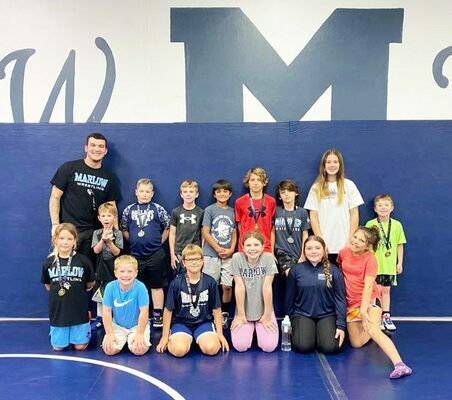 Marlow's young wrestlers competed Nov. 5, 2022 at Blanchard. Front row, left to right: Hayleigh Hoogendoorn, John Crawford Dennis, Ethan Staggs, Madison Phillips, Bailey Coyle, Kenleigh Henry; back row, l-r: Coach Tyler Lavey, Brantley Robertson, Sam Nugent, Camdyn Hines, Gavino Perez, Bryce Starr, Vitus Starr, Ava Toumbs and Ty Dennis. Photo Submitted