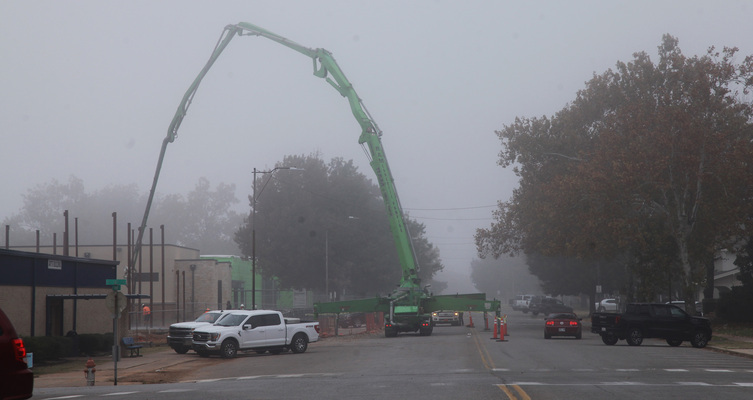 Heavy equipment and the early morning fog offer residents an interesting view of Main Street on Nov. 16, 2023. Traffic was detoured only temporarily. The equipment shows progress of the construction of the Marlow High School Performing Arts Center which voters approved as part of a school bond package for improvements in an election in February 2022. To date, safe centers have been completed at both the high school and middle school campuses. Photo by Toni Hopper/The Marlow Review