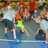 ALL THE RIGHT MOVES: Oklahoma State assistant wrestling coach Zac Esposito gives instructions on a takedown to elementary school wrestlers at the Rick Henshaw Memorial Stephens County Wrestling Camp in Marlow on Tuesday morning. The camp concludes today (Thursday) with a double-elimination tournament.