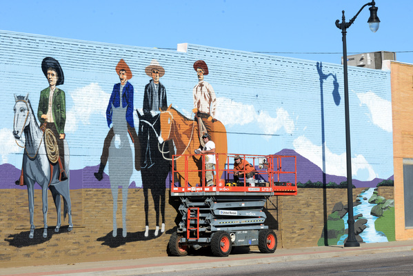 Darry and Terry Shaw of Lawton work on the mural of the Marlow Brothers on a sunny, clear day in November. The mural is on the east side of The Dollar General at US-81 (Broadway) and Main St. in Marlow, OK. Photo by Toni Hopper/The Marlow Review