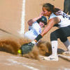 BEATING THE THROW: Bray-Doyle’s Kaily Early steals home in a game Monday.