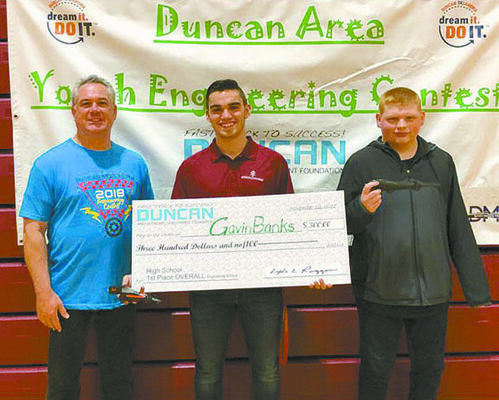HIGH SCHOOL WINNERS: DAEDF President Lyle Roggow presents checks to High School Overall Competition winners: Gavin Banks of RRTC (Marlow) and Roland Cook of Duncan. 