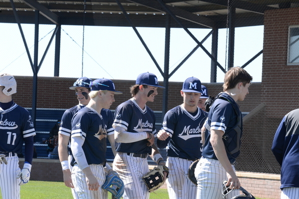 Marlow Outlaw Baseball team members head to the dugout during a break in the home game against Clinton, March 9, 2024. They won the game 8-0. Photo by Toni Hopper/The Marlow Review