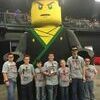 THE RENEGADES: James Hollis, Malakye Laughlin, Aiden Beutler, Tyler Stewart, Alexa Lee, Kai Guillory, and Isaiah Oxford stand with Lego Man.