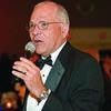 WORKING THE MICROPHONE: Butch Graham performs as the master of ceremonies at an IPLOCA annual convention.