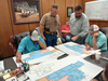 In Monday’s county commissioners meeting, preliminary plans for the renovation of the
Courthouse Annex building were presented by architect Josh Schoenborn. The east half of
the old Duncan Banner building will be used by the Stephens County Sheriff’s Office once
the renovation is complete. From left, Commissioner Kreg Murphree, Undersheriff Rick
Lang, Schoenborn and Commissioner Russell Morgan review the plans. Commissioner Todd
Churchman was also at the table, but not pictured. Photo by Toni Hopper/The Marlow Review