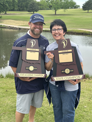 Coach Mikey Eaves and his mom, Peggy, proudly display the 3A State Champion Trophy for the Lady Outlaws big win that concluded the 2023 season. Photo by Kenlee Wilson