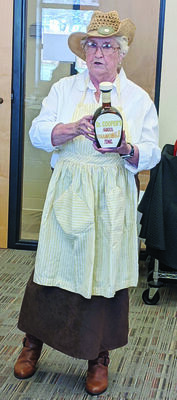 Bettie Cooper entertained Patio Garden Club members as a “Snake Oil Lady” from the 1880s at the February meeting held at the Garland Smith Public Library in Marlow. She also talked about the interest in herbal remedies in today’s society, noting that Chamomile has many uses, other than just for tea. Photo by Cricket Holland
