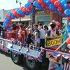 WINNING FLOAT: Children throw candy from the Gregston’s Nursing Home float at the 4th of July parade last Wednesday. The entry won first place in the float contest.