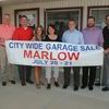Marlow Chamber of Commerce board members promote  the City Wide Garage Sale being held July 20-21 in Marlow