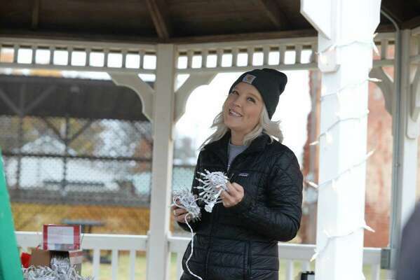 Marlow Chamber of Commerce Executive Director Destiny Ahlfenger shares a smile as she helps with decorating the Marlow gazebo prior to the annual Christmas Parade that happens Saturday, Dec. 3, 2022. Photo by Toni Hopper