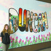 FINISHED PROJECT: Alyssa Cox of Marlow stands beside the mural she painted for a business at the
mall in Duncan.