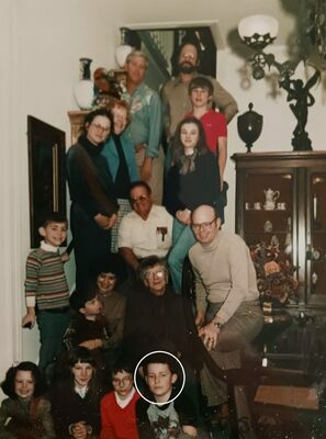 This photo is of the Henderson Family Christmas from 1980. Pictured at the front in the circle is future OICA CEO, Joe Dorman. The expression on his face is explained by the fact he had just broken his arm in a family football game.