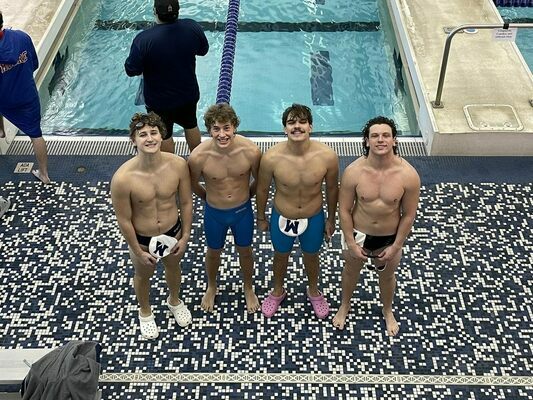 Gage DaVoult, Logan Woods,
Luke Banks, Karsten Terrell
smile big as they earn success at the Duncan Swim
Meet, Friday, Jan. 6, held at
the Simmons Center