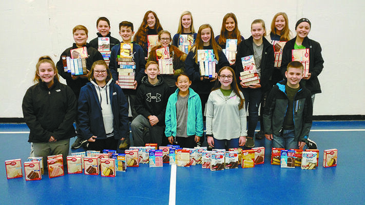 GIVING A HAND: Marlow's Middle School Student Council gathered 268 cake mixes for the upcoming Samaritan Christmas box distribution set for Saturday. 