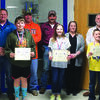 Bray-Doyle Students of the Month Rayden Crow, Carlie Foster, and Caleb Baker pose with members of the school board and superintendent David Eads.
