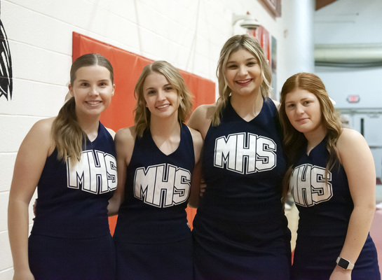 Marlow High Cheerleaders (l-r) Chesnie Stuart, Kylie Barrington, Chloe Boyster and Emma Gore smile after the Outlaw boys won the 93rd Stephens County Basketball Tournament championship at Comanche. 
Photo by Toni Hopper/The Marlow Review