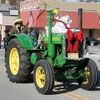 CHRISTMAS PARADE: A decorated antique tractor makes its down Main Street in Marlow during last year’s Christmas parade. The 2016 version of the parade begins at 10 a.m. on Saturday.