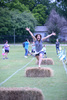 Marlow Elementary School Counselor, Julie Harris, jumps for joy as she joins in the Field Day fun at the end of the 2022-23 school year. It was 66 degrees and it rained, but it didn't stop the students and faculty from celebrating. 
Photo by Toni Hopper/The Marlow Review