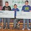 MIDDLE SCHOOL WINNERS: DAEDF Chairman Terry Snider, and President Lyle Roggow present checks to Middle School Race and Overall Competition winners Roland Cook of Duncan Middle School, Hayden McKinney of Marlow Middle School, and Grant Lagaly of Duncan Middle School.