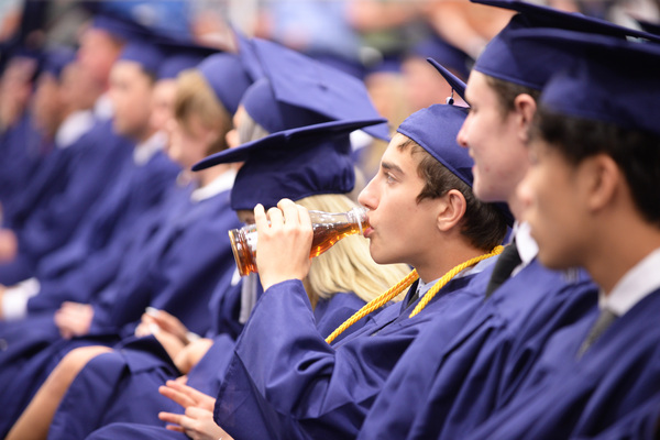 Outlaw senior James Stout drinks his tea during the graduation program for his class. The graduation was held in the Outlaw Gymnasium (formerly known as the new gym), on 9th Street. 
Photos by Toni Hopper/The Marlow Review