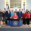 BILL SIGNED: AARP Oklahoma volunteers, staff, Sen. Adam Pugh and Rep. Marcus McEntire with Governor Mary Fallin at the ceremonial bill signing of HB 3328.