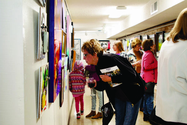 Guests attending the reception for the fifth annual Chisholm Trail Arts Council Holiday Show & Sale study the art on display at the CTAC gallery in Duncan, Nov. 17, 2022. Photo Submitted by Darcy Reeves