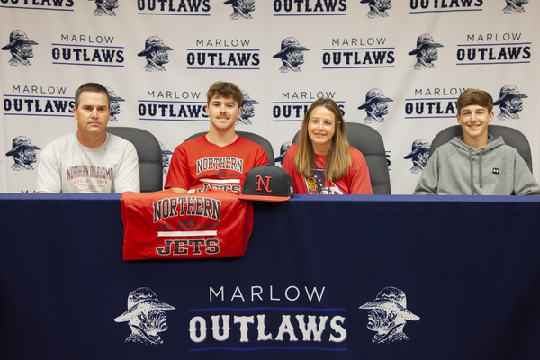 Cooper Smith signed Tuesday, May 16, 2023, to play with Northern Oklahoma College Jets in Enid. Parents Randy and Tara, and brother Brisco, witnessed the big moment for him. The signing was held at the Marlow Public School district office. Photo by Toni Hopper/The Marlow Review