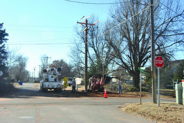 City of Marlow employees work to replace a power pole on 4th and Caddo Streets earlier this week, continuing the public improvements reported by the Review in 1906.

Photo by Elizabeth Pitts-Hibbard
