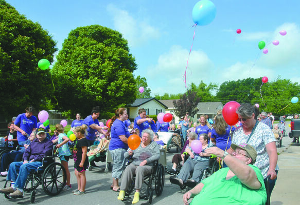 Residents at Gregston's Nursing and Rehab release balloons to celebrate the annual "Spring Stroll."

Photo by Elizabeth Pitts-Hibbard