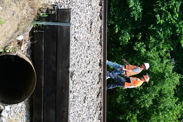 Railroad workers walk the tracks looking for damage following the train derailment on Sunday, June 4, 2023. Photo by Toni Hopper/The Marlow Review