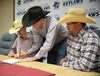 Korben Baker and his
dad, Kenny, right, watch as Fort Scott Community College Coach Chad Cross adds his signature to the scholarship letter of intent offered to
Baker. The Marlow High School senior will join the FSCC in Kansas, rodeo team and compete as a saddle bronc rider. Photos
by Toni Hopper/The Marlow Review