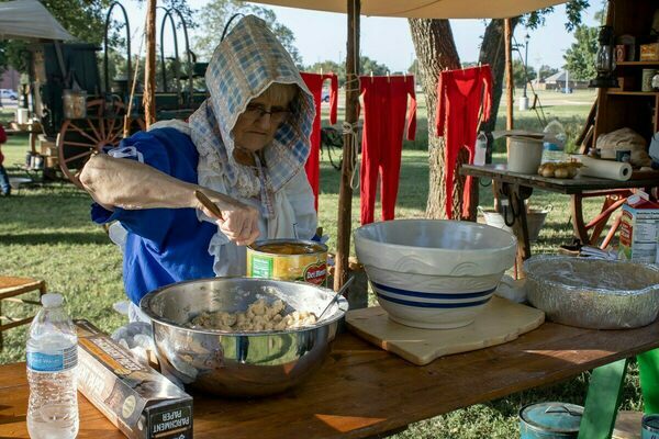 Carlann Miller prepares a deep-dish peach cobbler during Western Spirit Celebration Day at the Chisholm Trail Heritage Center last fall (2022). She and husband, Jack take their chuckwagon to numerous events. Photo by Dee Dodson/The Marlow Review