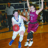 THE DRIVE: Marlow’s Molly Koons slips by a Tuttle defender in the Lady Outlaws’ win last Friday night.